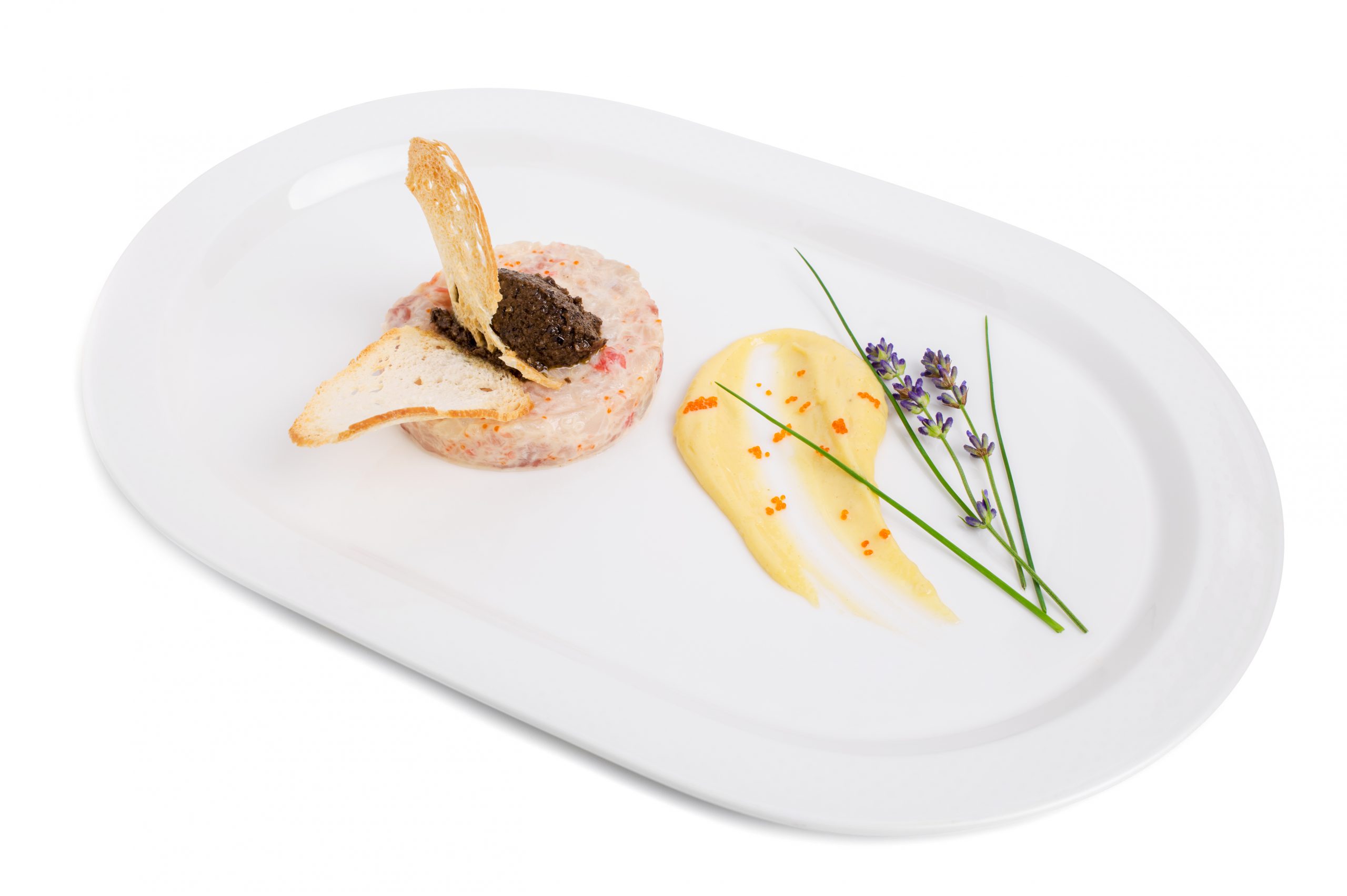 Salmon tartare with black truffle sauce.